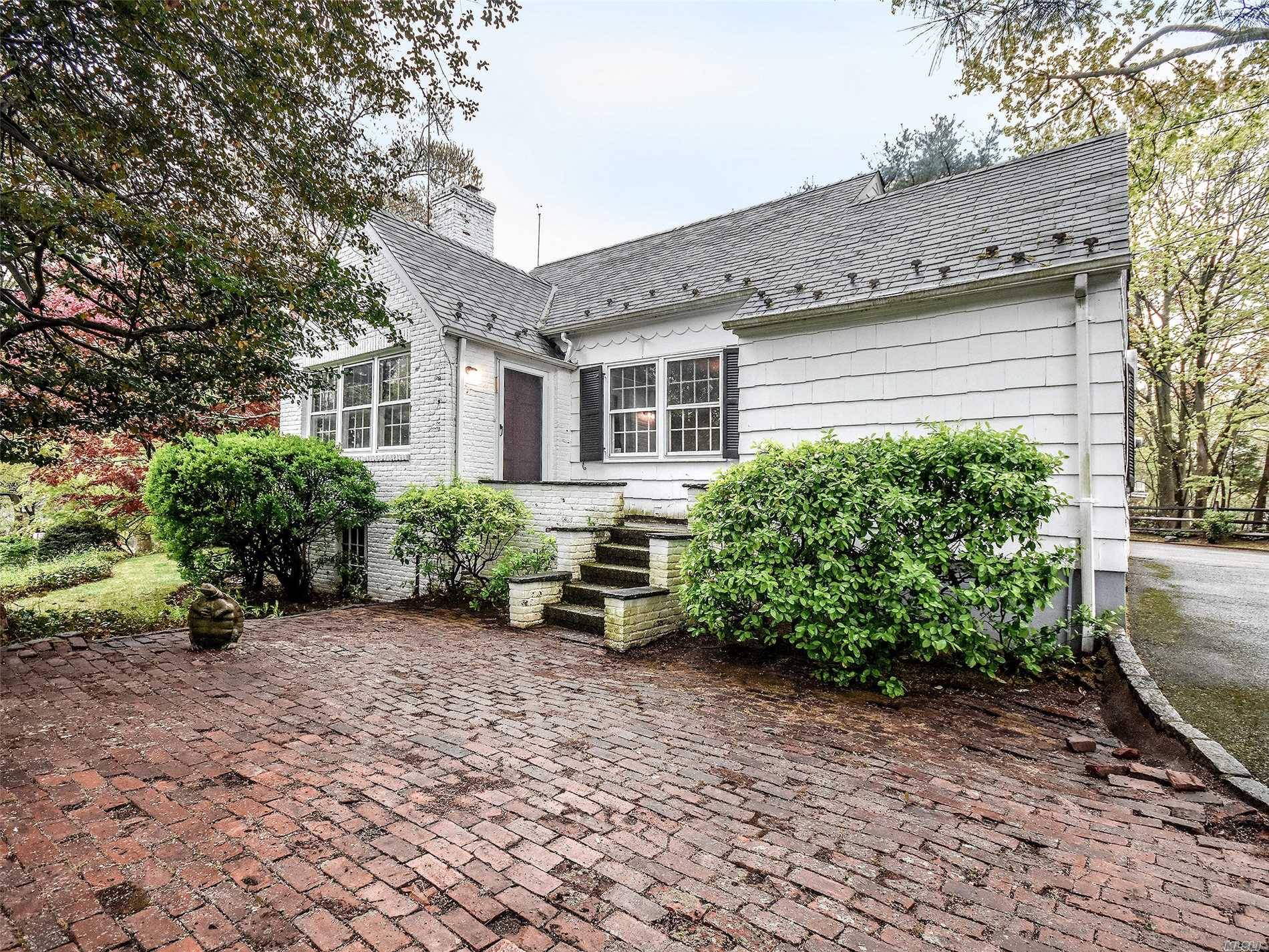 Quaint Charming Cape located in sought after Manhasset Bay Estates.