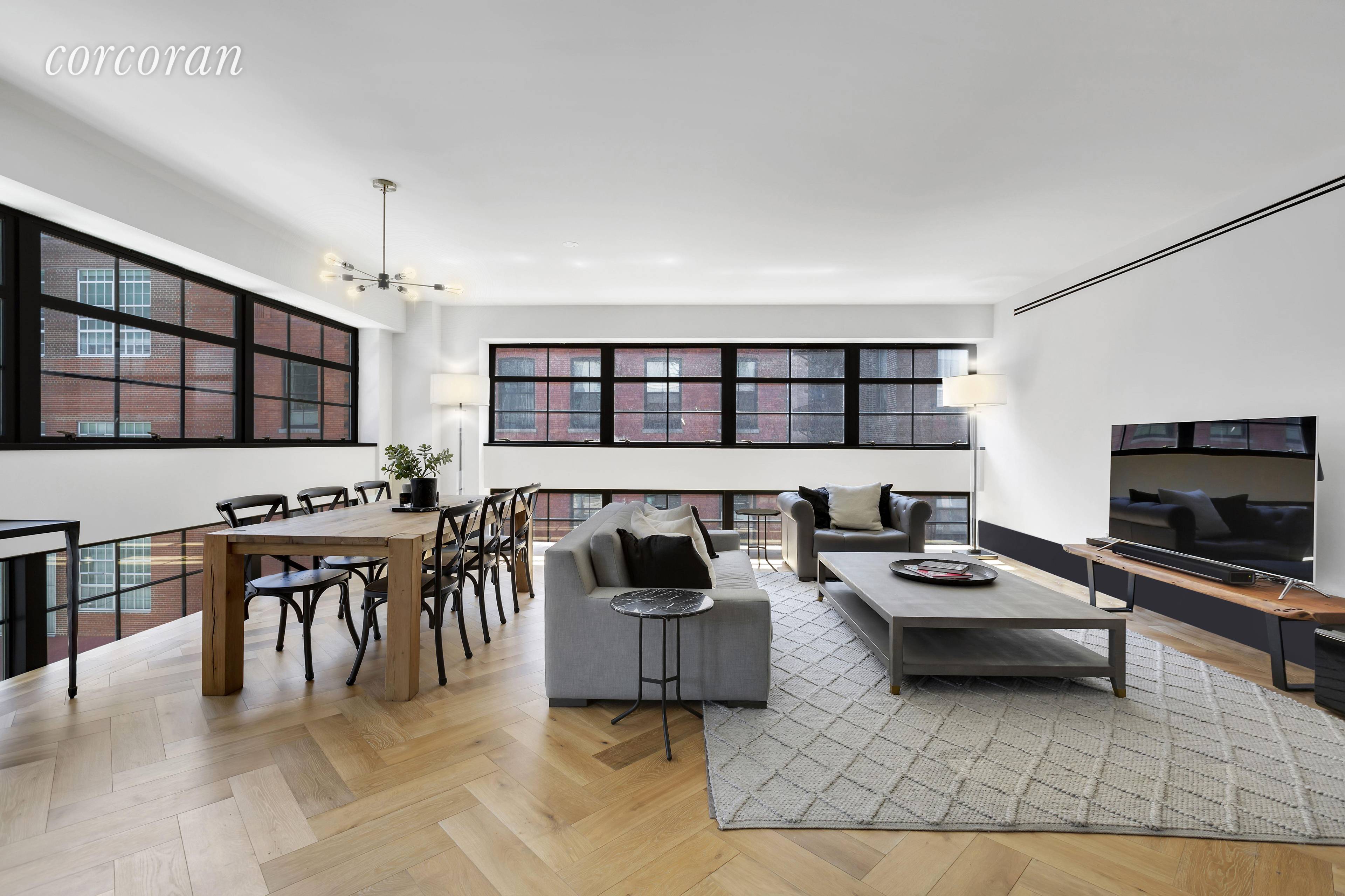 Welcome home to this stunning three bedroom, three and a half bath condo loft in prime DUMBO.