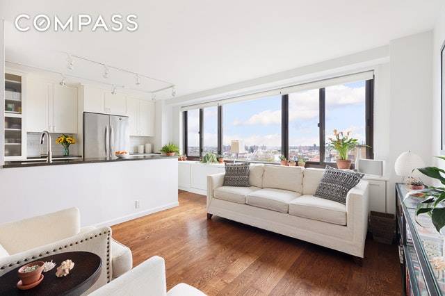 Located on the top floor of a centrally located Clinton Hill co op, this stunningly gut renovated 2 BD 2BA corner apartment affords breathtaking views of the Manhattan skyline.