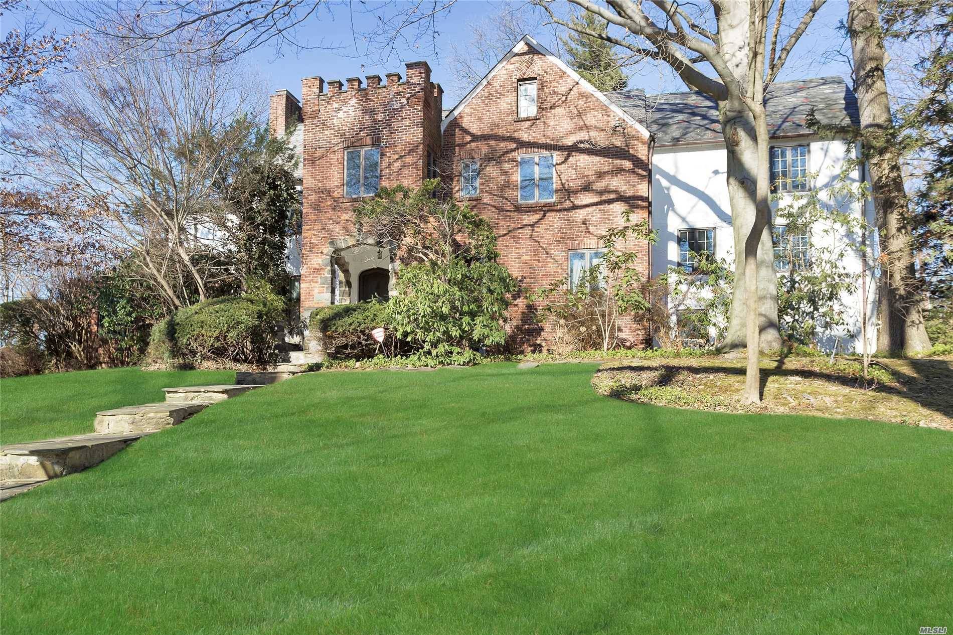 Prominent Over Sized Center Hall Brick Stucco Tudor On Almost 1 2 Acre Grounds.