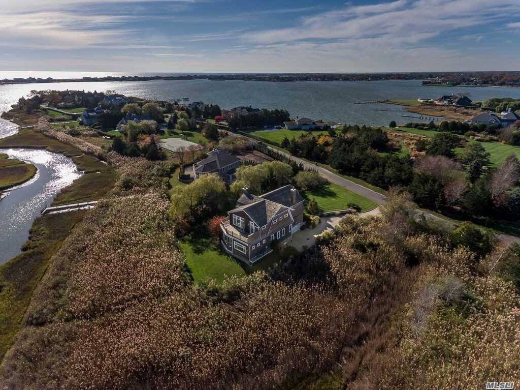 Sweeping Waterviews ! Two Story Nantucket Style Home Offering Views Of Quantuck Creek.