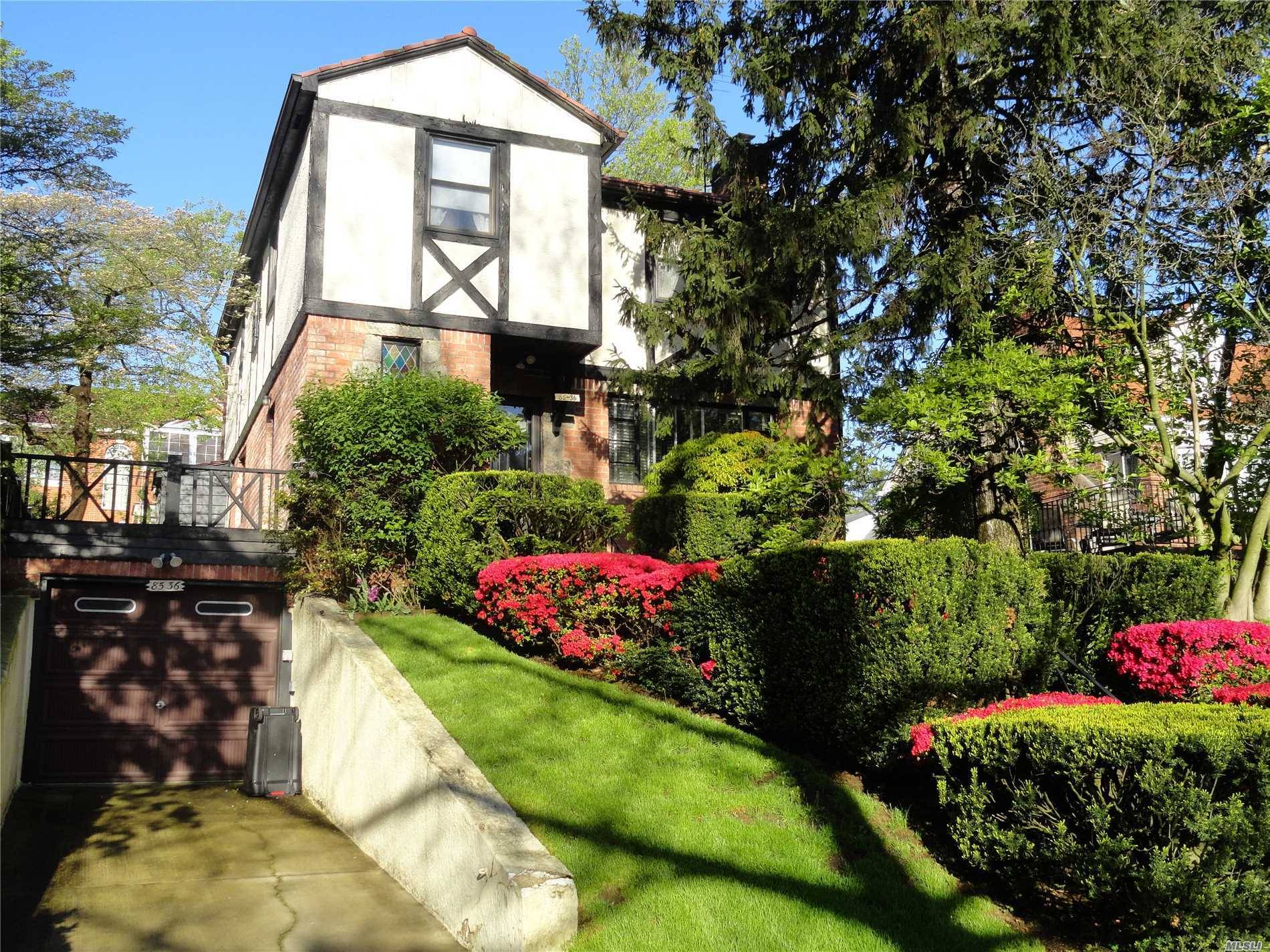 Beautiful, elegant, bright, airy Tudor home with commanding views and inviting layouts.