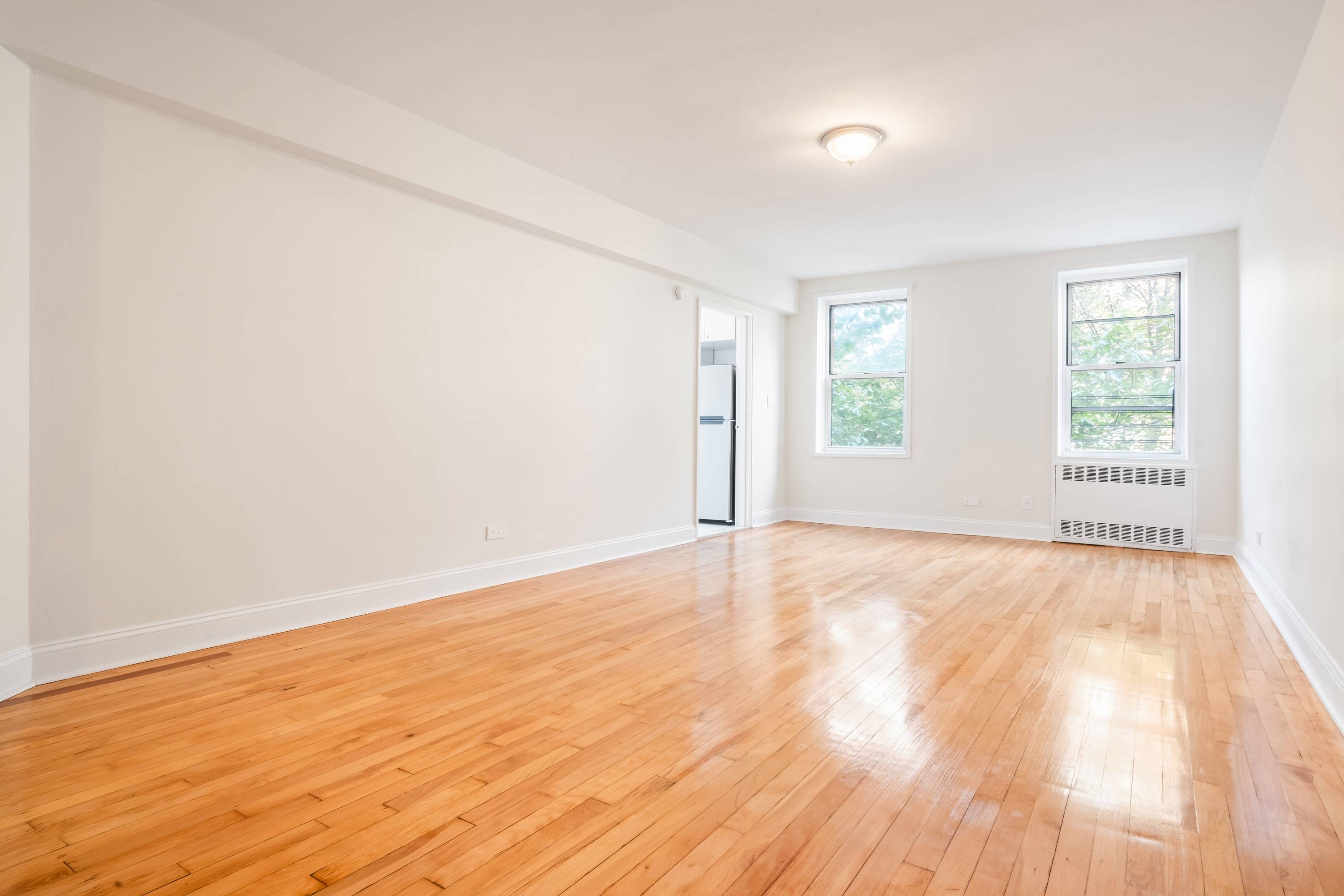 This two bedroom, one bath apartment, located in Jackson Heights features windowed kitchen and bathroom along with great closet space and hardwood floors throughout.
