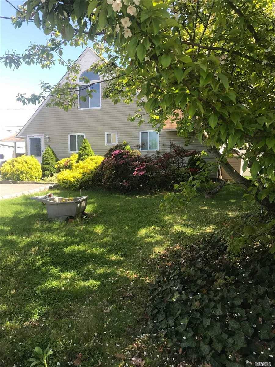 Welcome to this lovely Wantagh Levitt, Updated Kitchen, bath, windows, roof, siding.