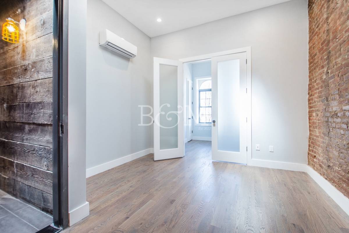 Our Thoughts As you walk into this stylish three bedroom apartment in Bushwick, you'll notice the designer has skill and imagination.
