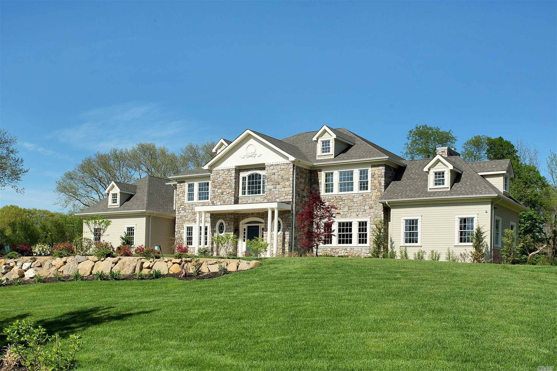 Unparalleled new construction with the epitome of design elegance in the 7400 sq ft colonial majestically set in a cul de sac location.