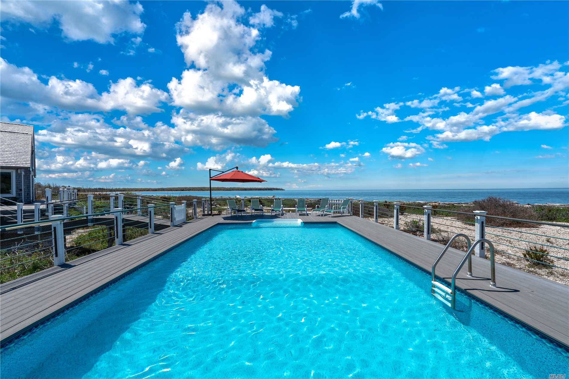 Uniquely situated on 3. 85 acres, sweeping views of the Long Island Sound the Great Peconic Bay can be seen from every room of this naturally light filled residence.