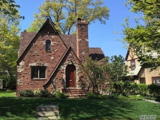 One of a Kind, Open spaced, timeless Tudor In The Prestigious Heart Of Historic Landmarked Douglaston Manor, Vaulted Ceiling, 2 Wood Burning Fireplaces, 2 Car Garage w Remote, Hardwood Throughout, ...