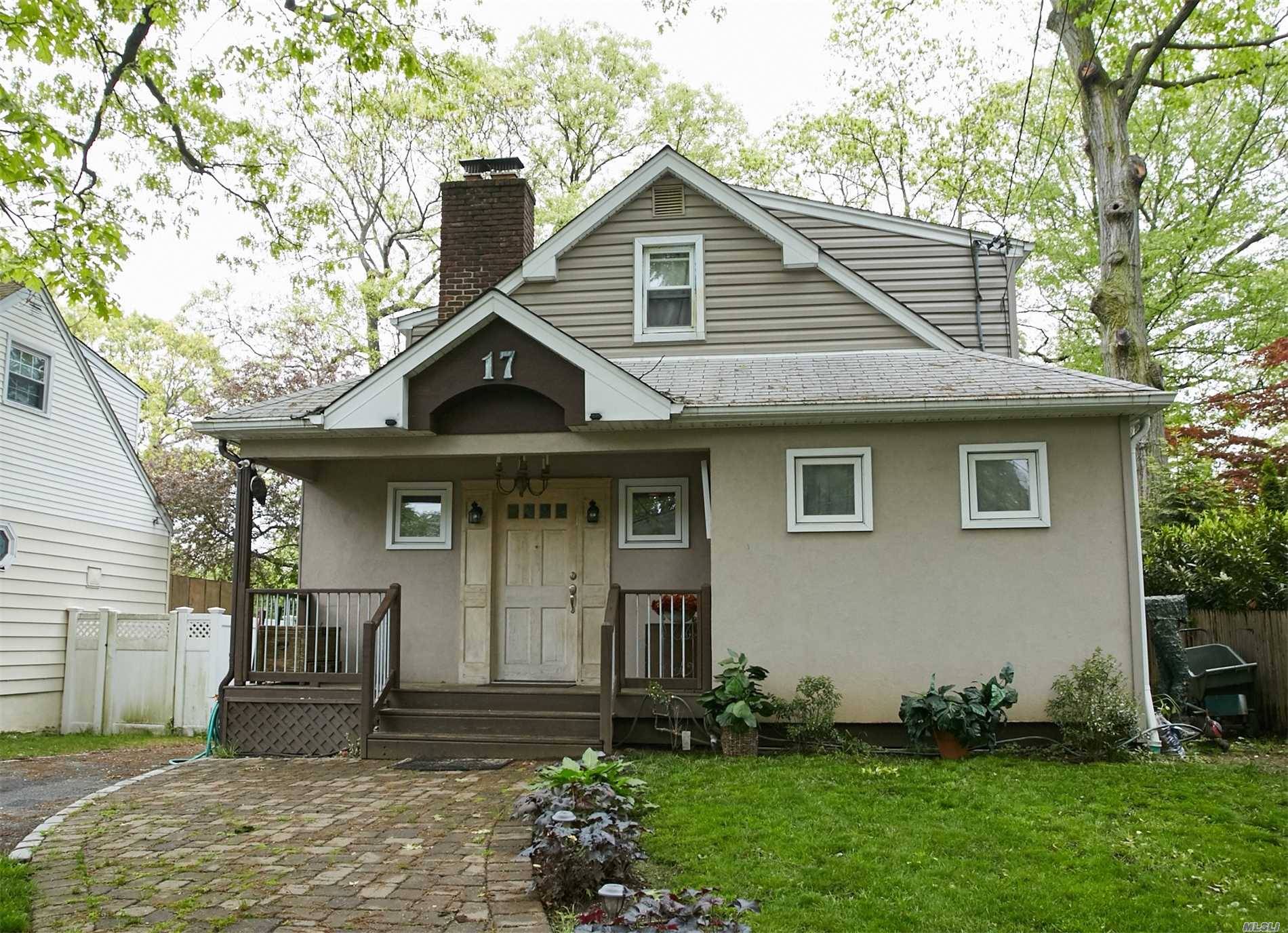 Beautifully Renovated Cape Cod Situated On a Quiet Tree Lined Street.