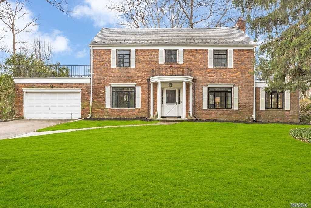 Stately All Brick Center Hall Colonial Located in the Highly Desirable Neighborhood of Harbor Hills with its Own Private Waterfront Pool Club and Tennis Courts.