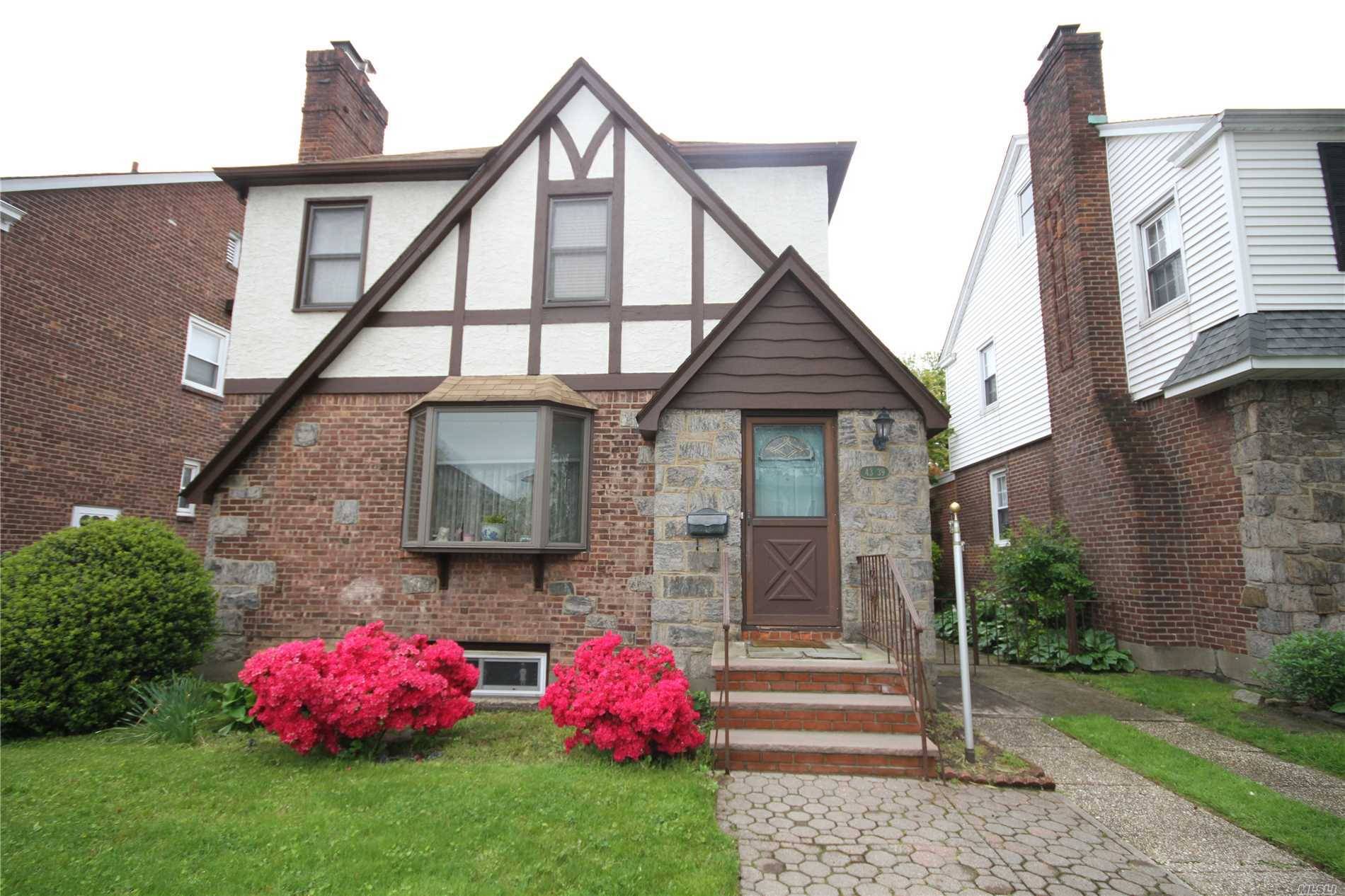 Sold brick, detached, Tudor Colonial in a great Auburndale location a half block from Northern Blvd.