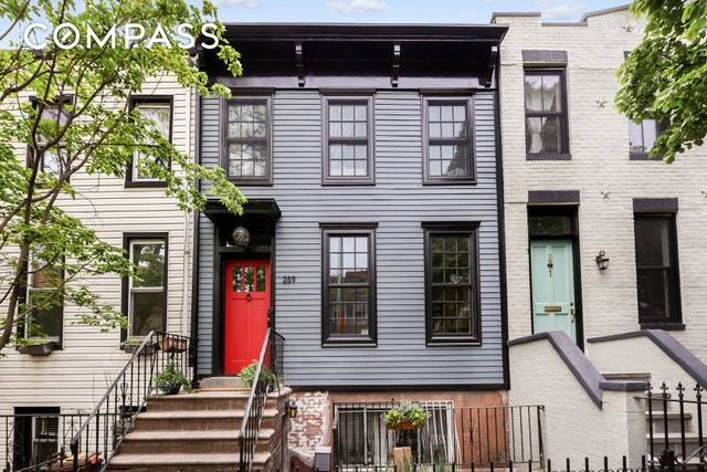 This legal 2 family townhouse has been thoughtfully reconstructed and designed with character throughout.