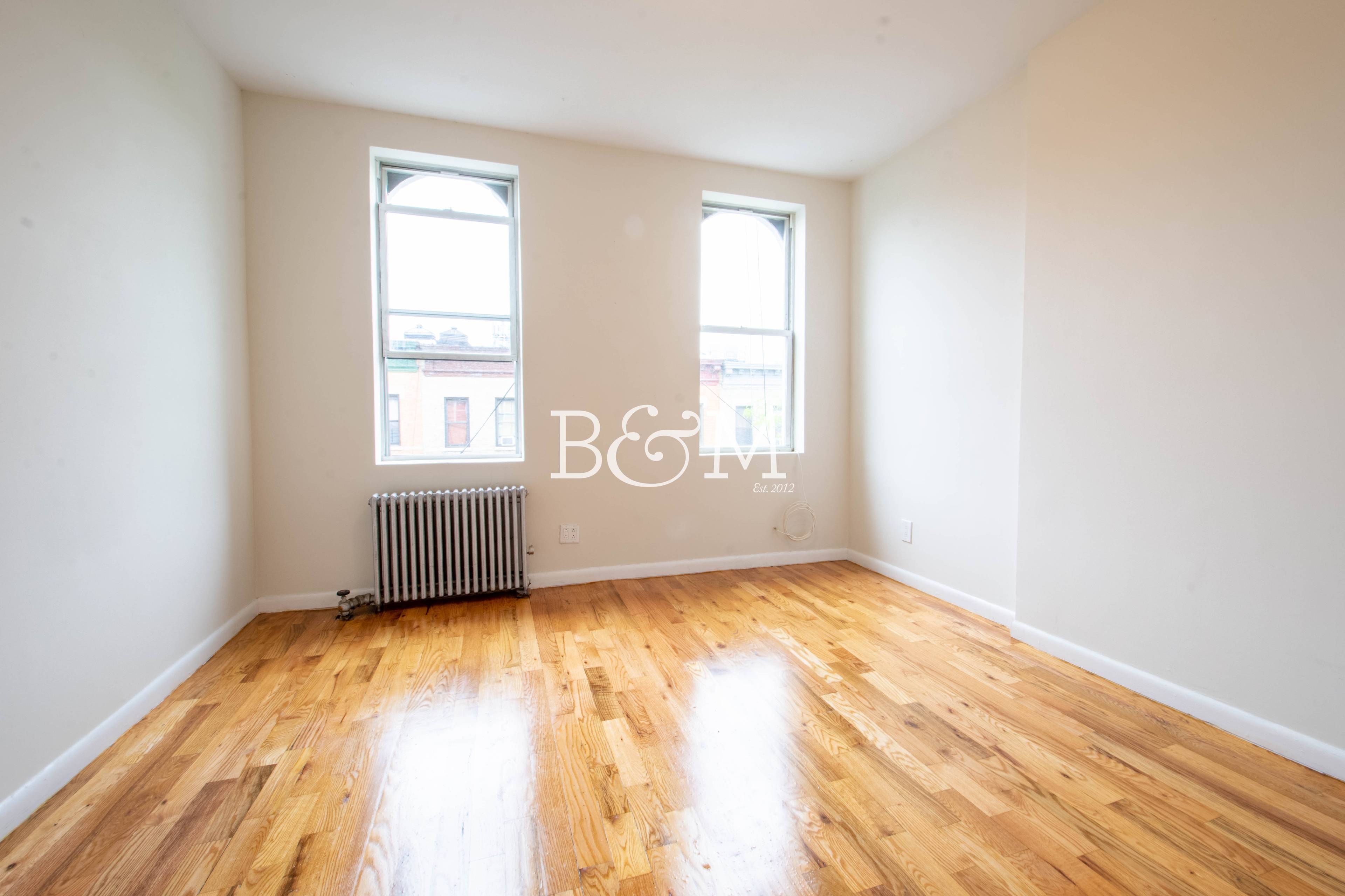 Our Thoughts This spacious two bedroom apartment features hardwood flooring throughout and tons of natural light.