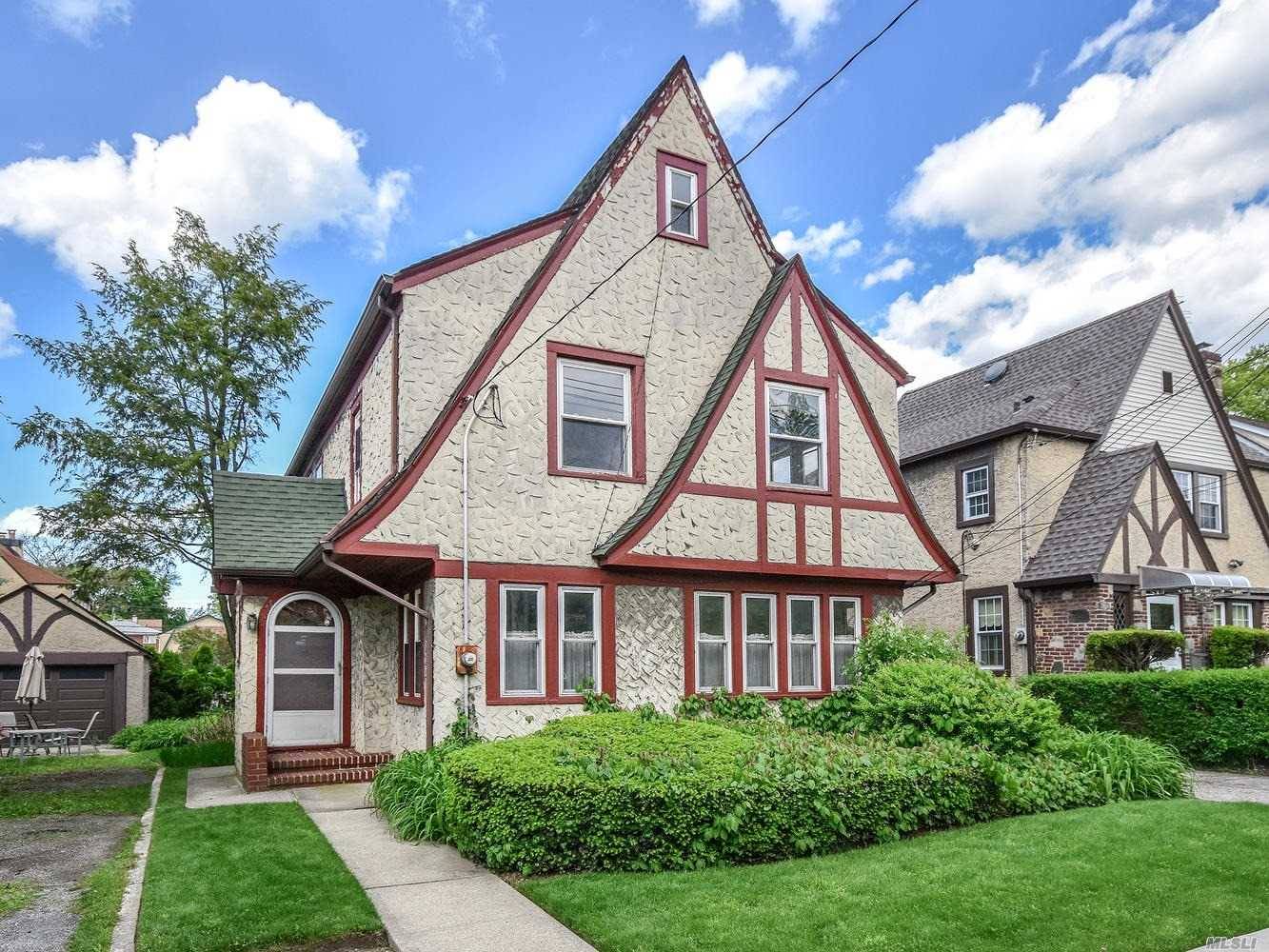 Wonderful opportunity to make this CHARMING, SUNNY tudor your own !