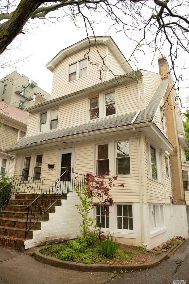 Spacious 3300 square foot detached house with original woodwork in the heart of Woodhaven.