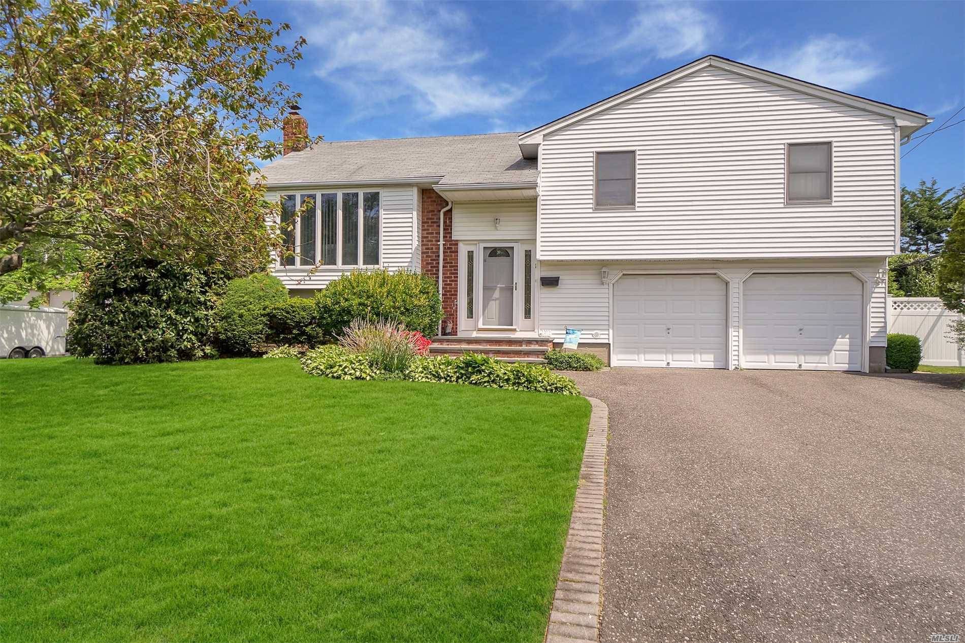 Welcome To This Unique Well Maintained High Ranch With A Split Feel In Desirable Commack.