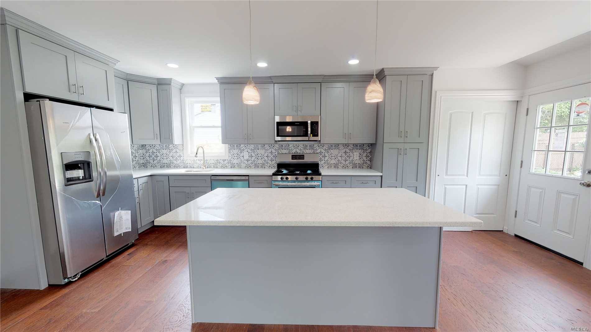 Beautifully renovated open concept split, accented with natural light, kitchen updated with perfection in mind.
