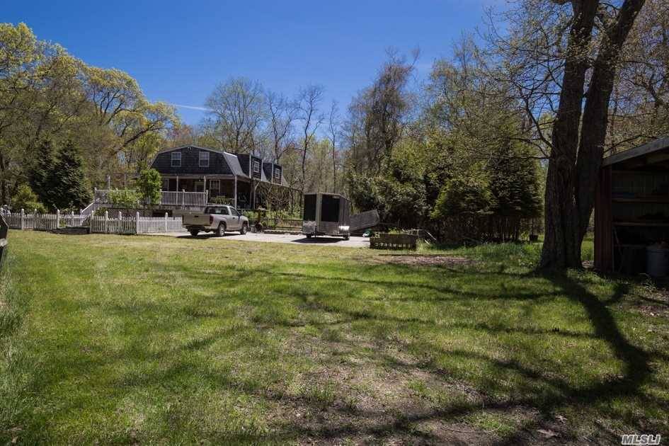 7. 1 Acre Private Property Completely Secluded Less Than 1 Mile North of Long Island Exprwy Just 2 Minutes To Manorville's Shopping Restaurants Conveniences.