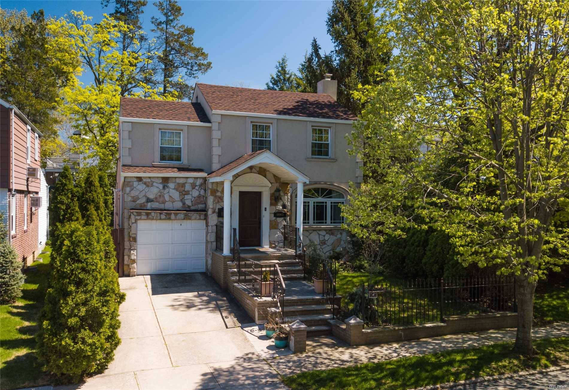Move right into this fully updated stucco stone colonial !
