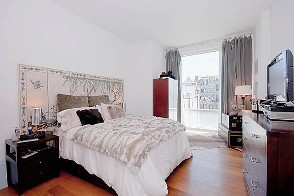 Two Bedroom two bathroom with open chef's kitchen and washer dryer in the Wooster Street building of Soho Mews Condo.