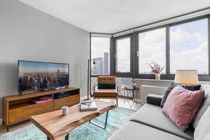 Rare Spacious Renovated Alcove Studio with Floor to Ceilings Windows, Beautiful Hardwood Floors Throughout and Western Exposure Situated in Tribeca