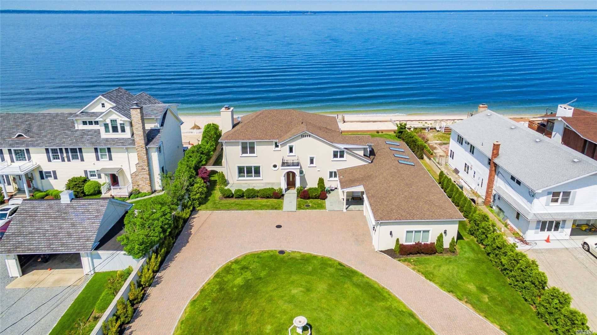 Spectacular 4300 Sq Ft Waterfront Home w 100 feet of Beachfront overlooking LI Sound Connecticut.