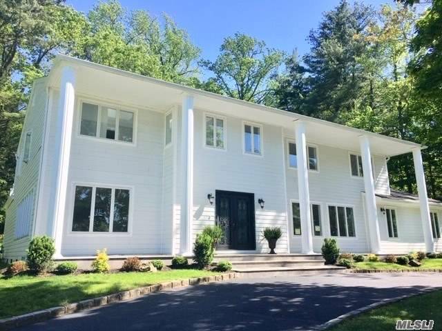 Totally Redone Center Hall Colonial Situated in Prestigious Country Estates with Circular Driveway.