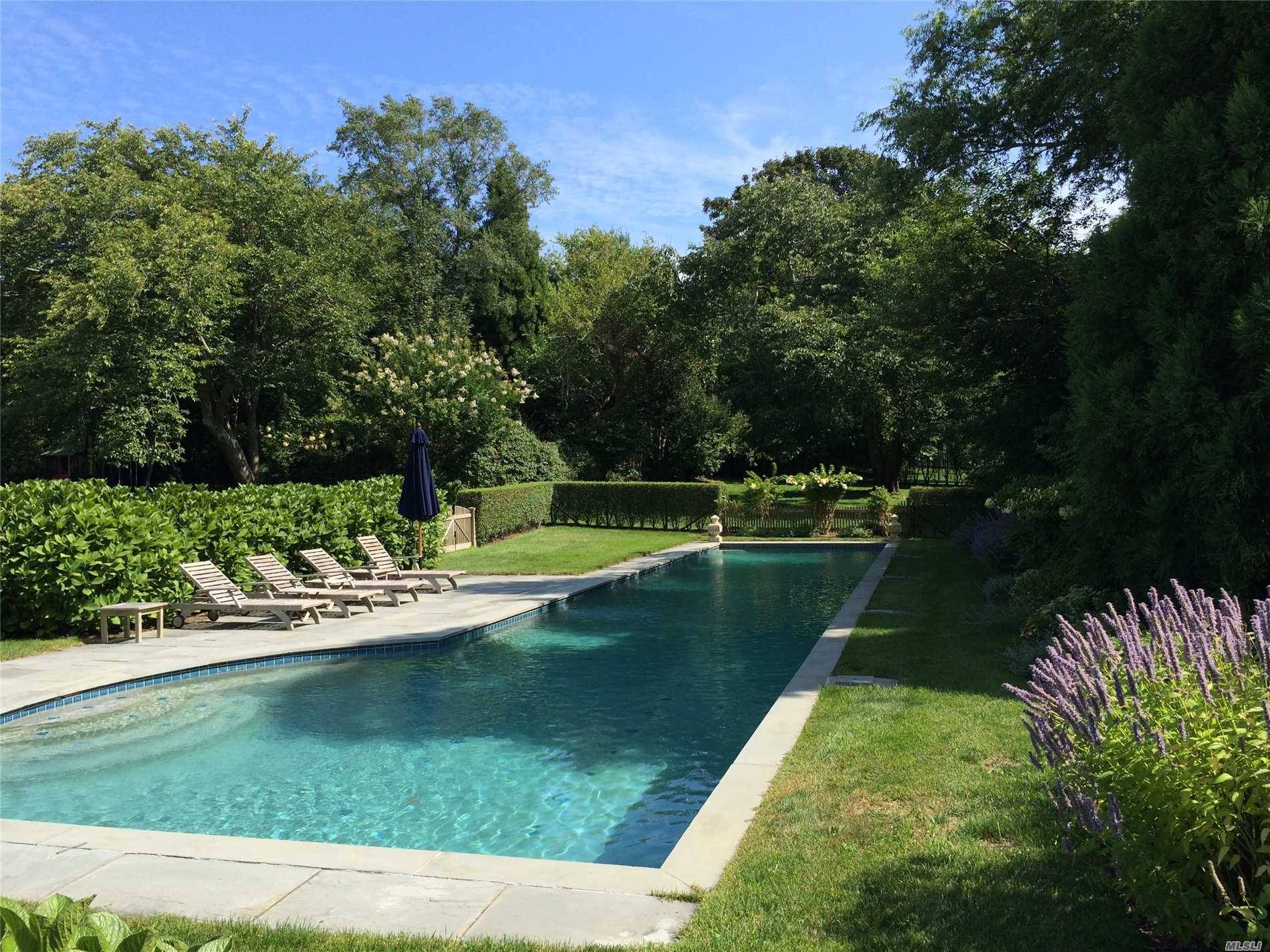 Gorgeous 1. 1 acre property hosts a recently renovated 4 bedroom and 4 bath home on a desirable street in East Hampton Village.
