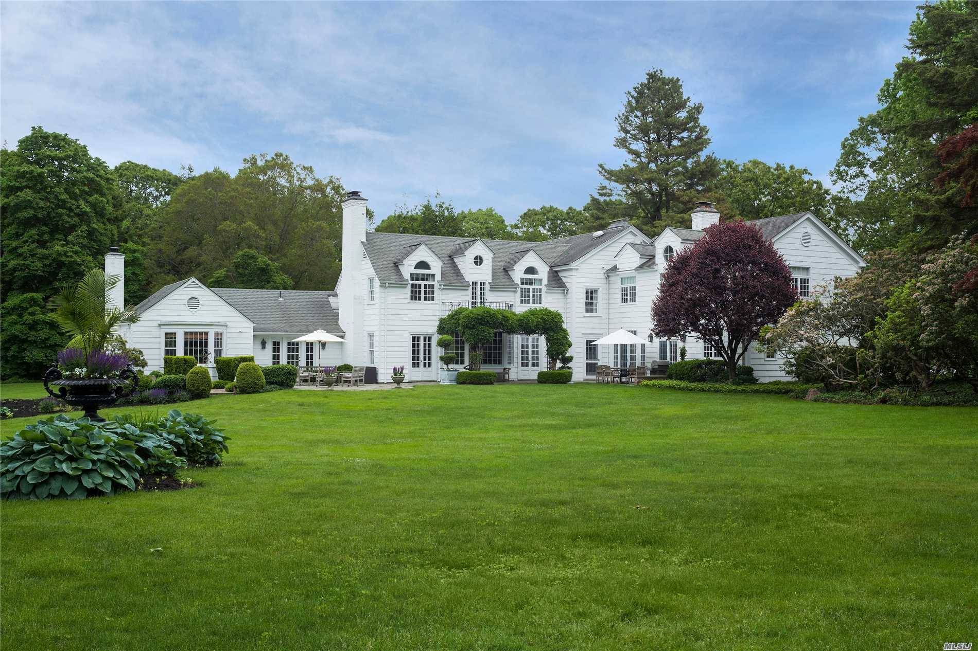 Quintessential country estate on over six acres in the heart of Matinecock.