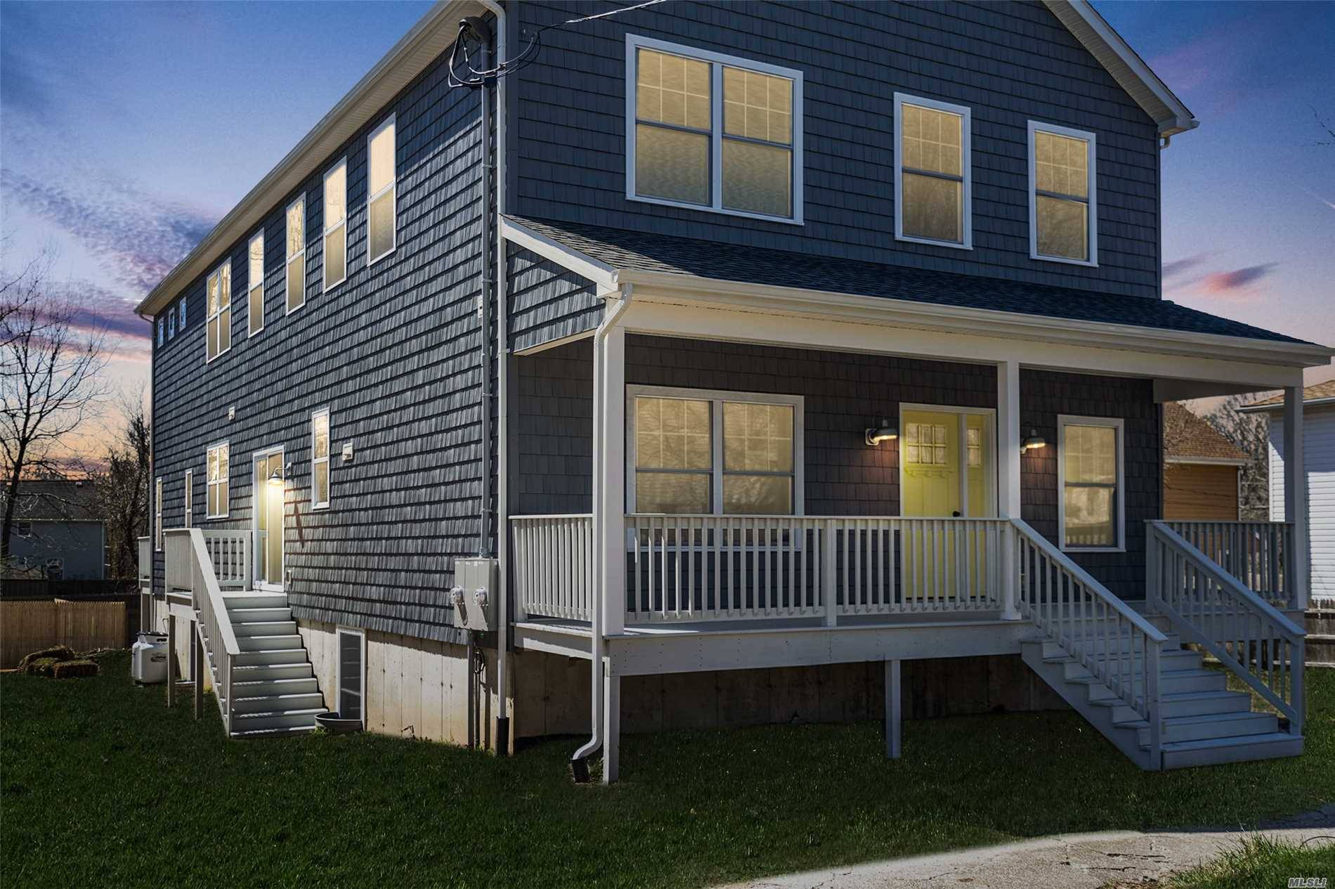 Greenport Village All New Two Family Residence with Covered Porches.