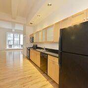 Renovated Live Work 2BR 2Bath apartment with very high ceilings, hardwood floors and light that streams in through the wall of windows.