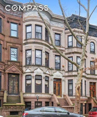 Welcome home to one of the most majestic limestone Townhouses in Park Slope's Historic district.