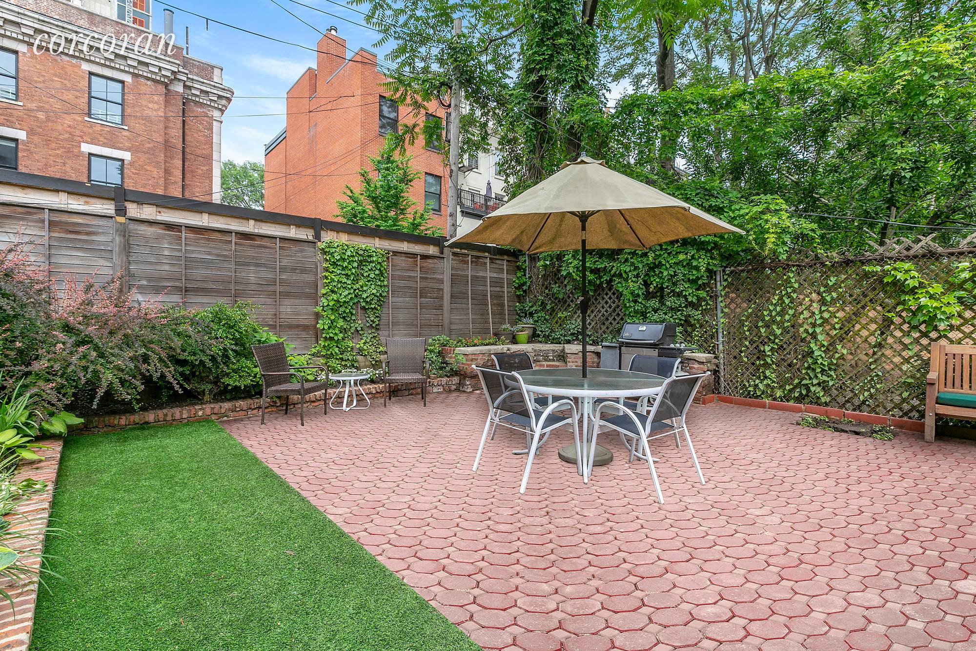 Cobble Hill two bedroom, two bath duplex with recreation room and stunning exclusive garden in classic brownstone.