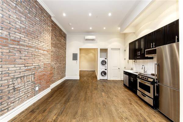 Gut Renovated Convertible 2 BR in the East Village! Includes Access to Furnished Roof Deck. ..NO FEE