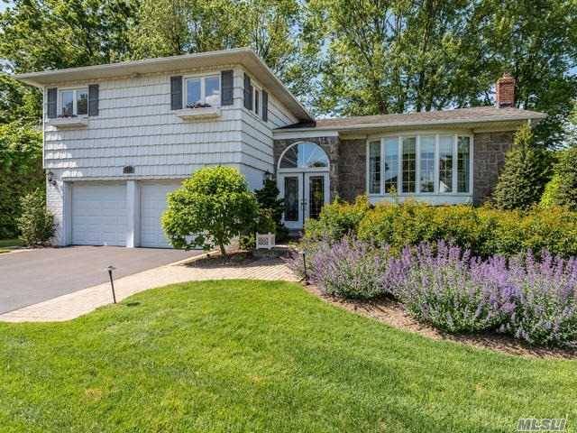 Bask In The Ambiance Of This Meticulously Maintained Split Level Home.