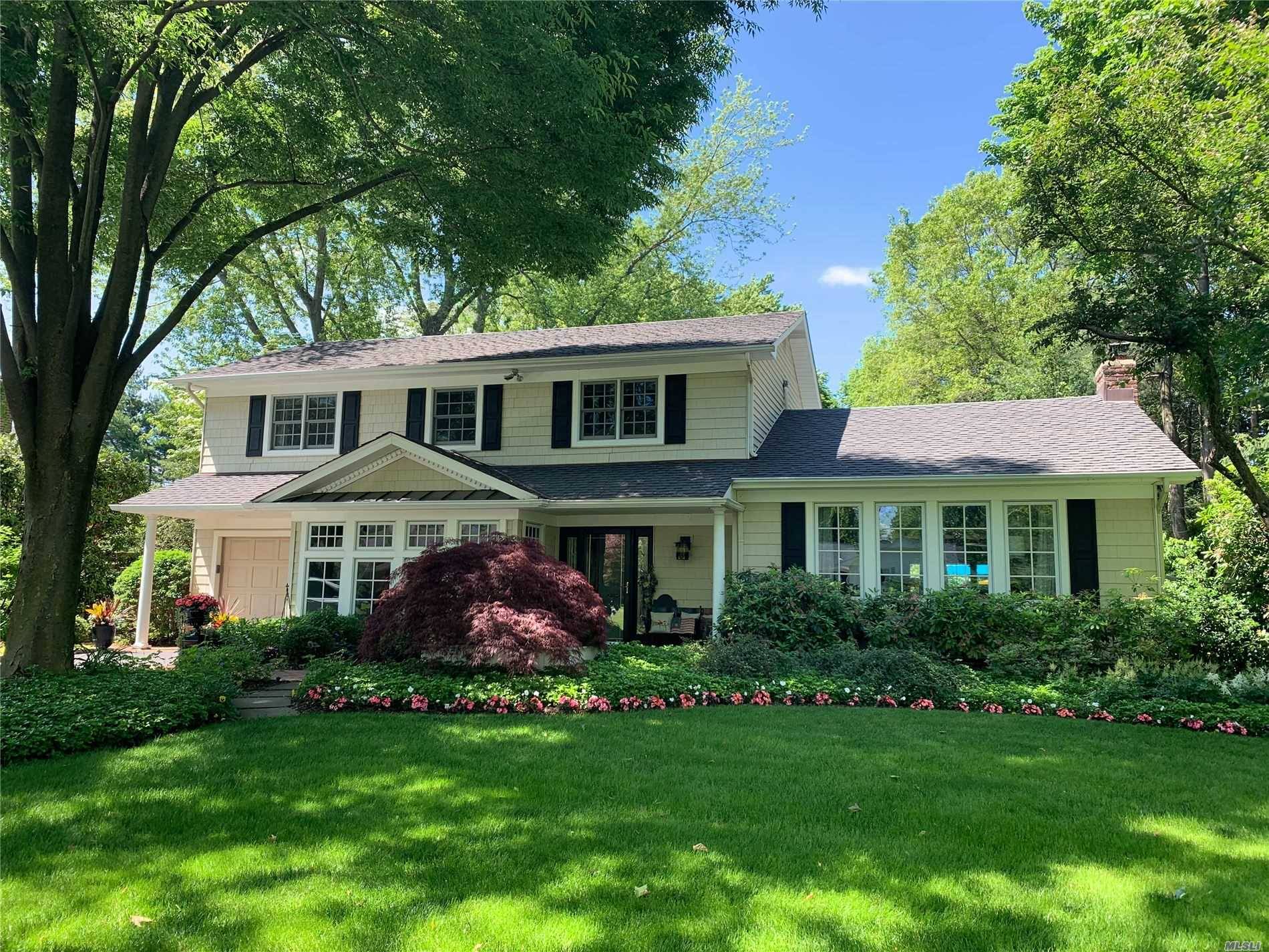 Picture Perfect Colonial Situated on Over Half an Acre With Meticulously Landscaped Grounds, This Incredible Colonial Features 4 Bedrooms, 2.