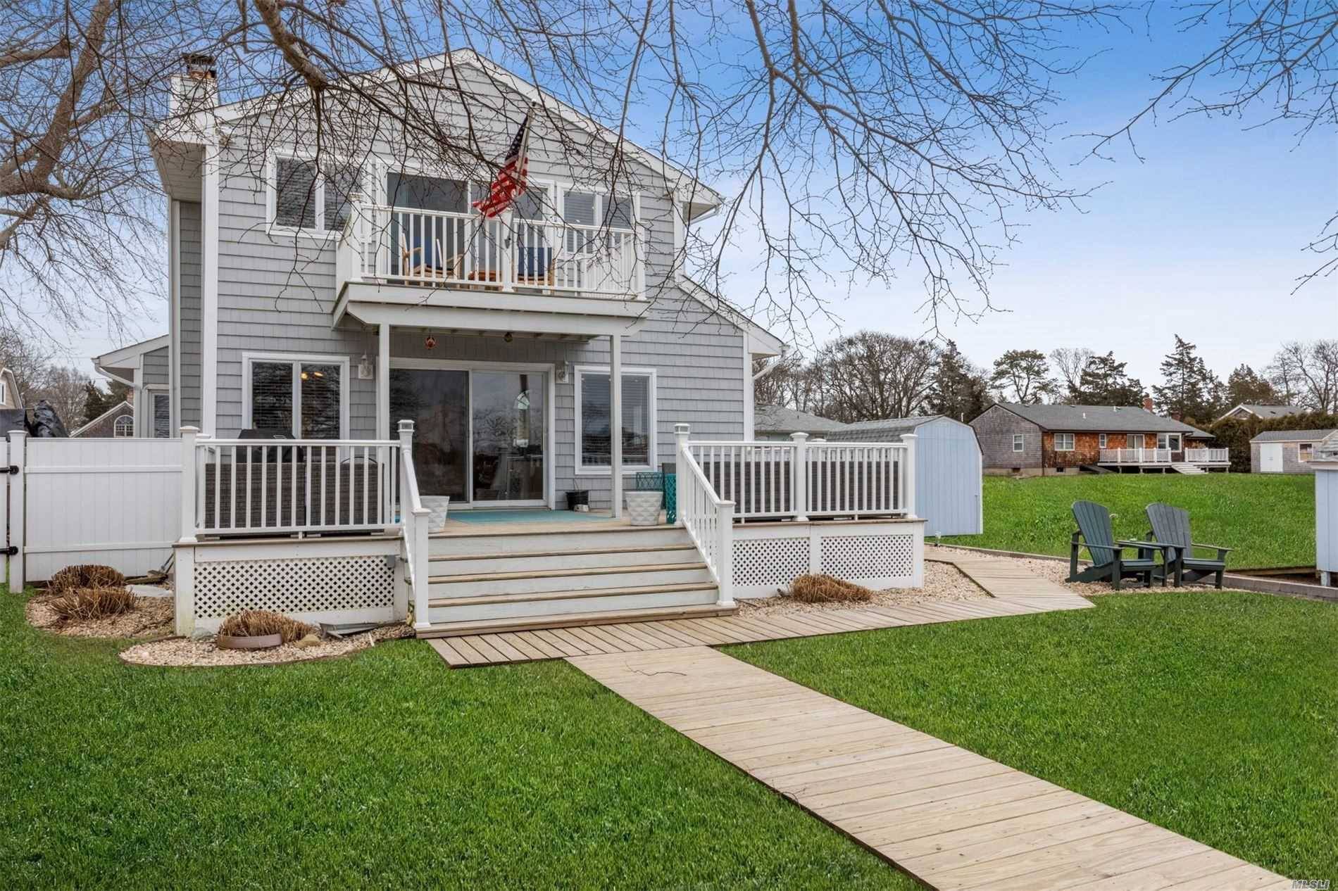 Water front home with with deep water docks on Meeting House Creek with easy access to Peconic Bay.