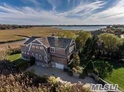 Sweeping Waterviews ! Two Story Nantucket Style Home Offering Views Of Quantuck Creek.