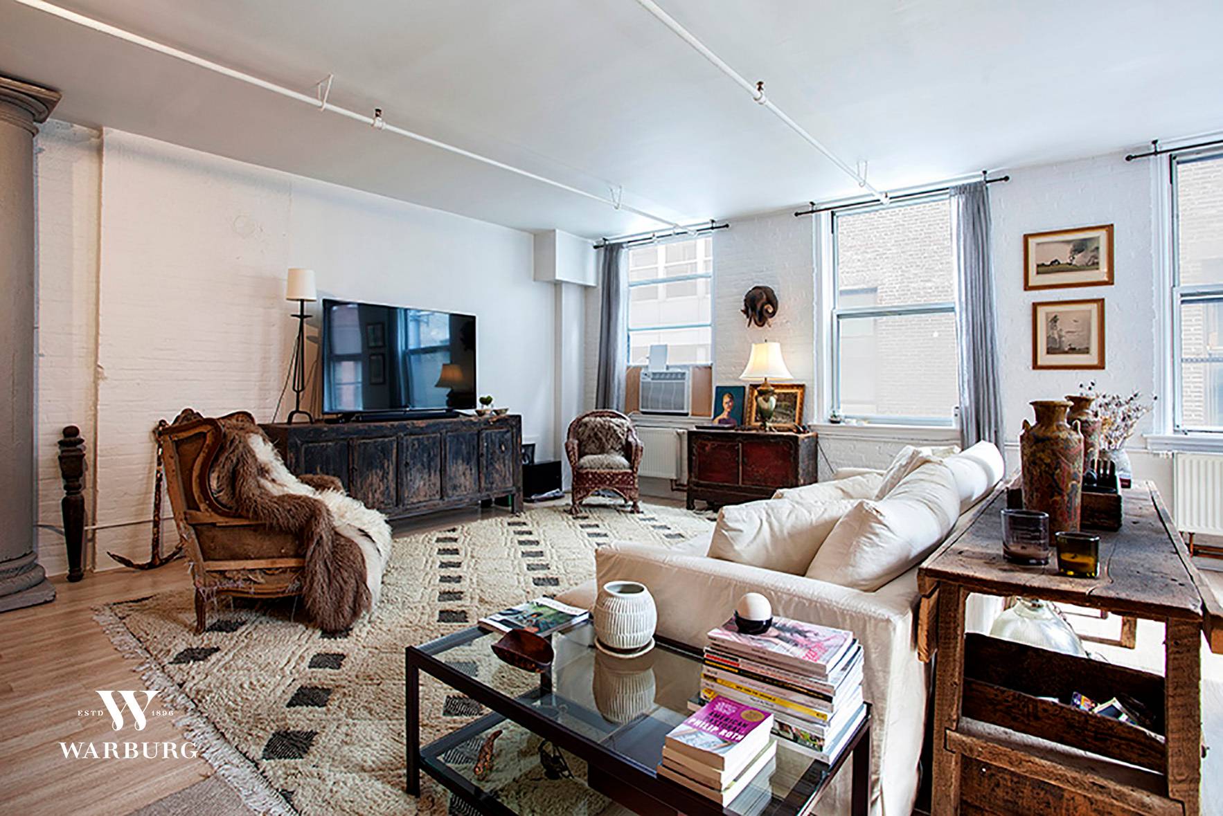 Nestled on one of the most coveted blocks on a quiet cobble stone street sits the quintessential open SoHo loft on Wooster Street.