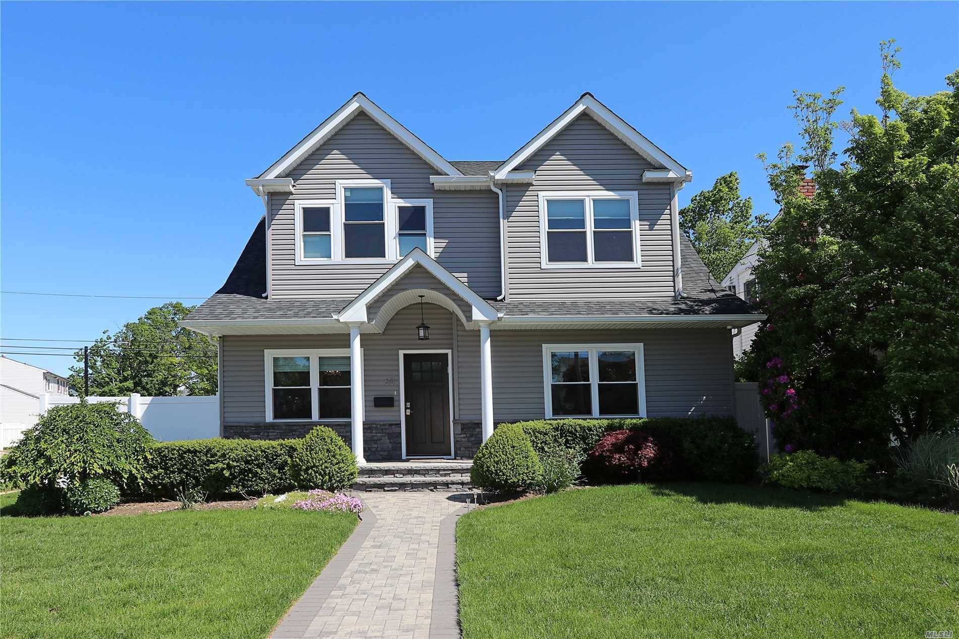 PRICE IMPROVEMENT ! ! Beautiful Spacious Colonial features an open floor plan with an EIK w Gas Cooking, hi end stainless steel appliances Quartzite counters.