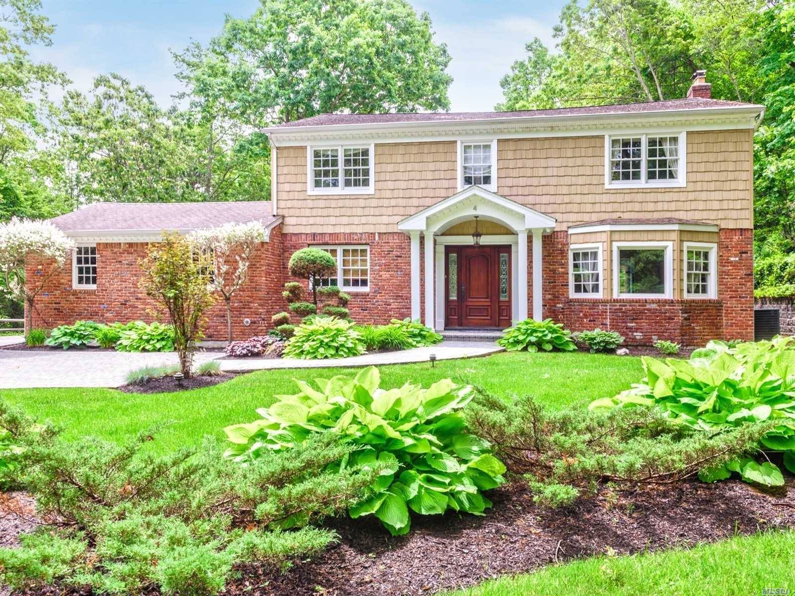 Dix Hills Spectacular, Grand, Updated Center Hall Colonial in desirable Winston Woods.