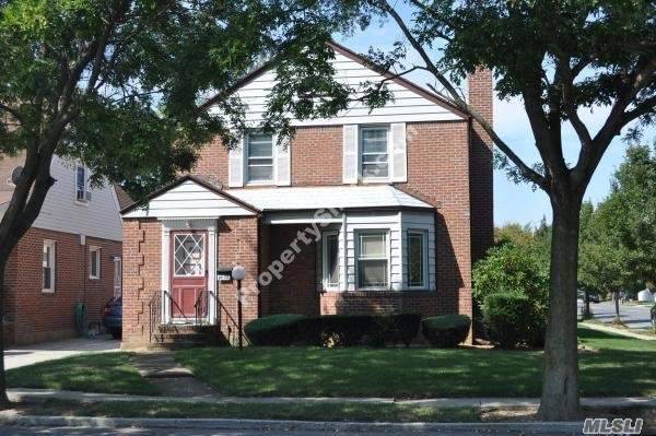 Corner lot property with manicured landscaping, conveniently located near public transportation and major Hwys Belt Pkwy, Cross Island, SS In ground sprinklers, Finished Basement, 2nd floor outdoor patio deck, Hardwood ...