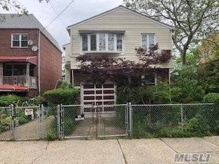 Detached Two Family Colonial With Full Unfinished Walkout Basement And An Attached One Car Garage Located In The Canarsie Section Of Brooklyn.