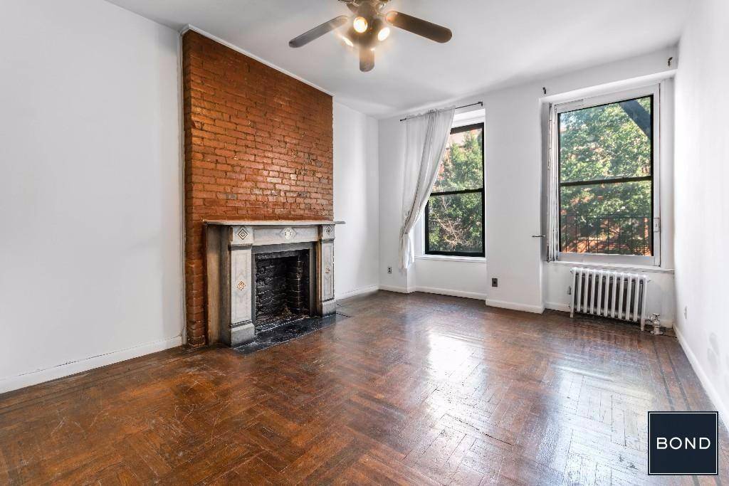 Over sized, sun drenched one bedroom apartment with a decorative fireplace, large, separate kitchen and ample closet storage space greatly located in the heart on the East Village, one block ...