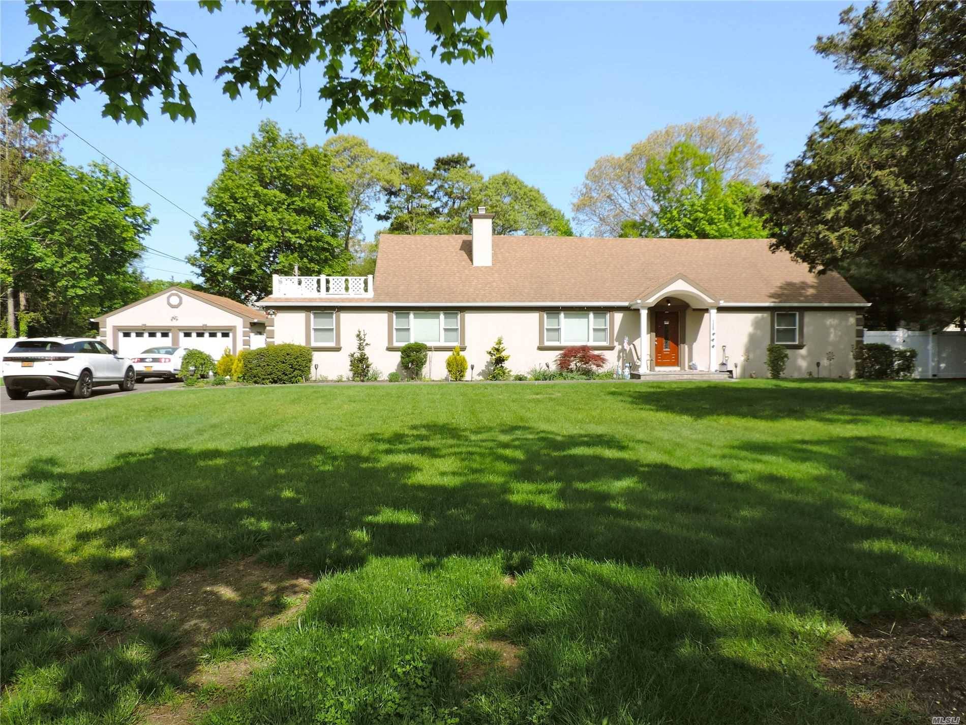 Stunningly renovated huge home on serene street located in Bellport Beach Estates.
