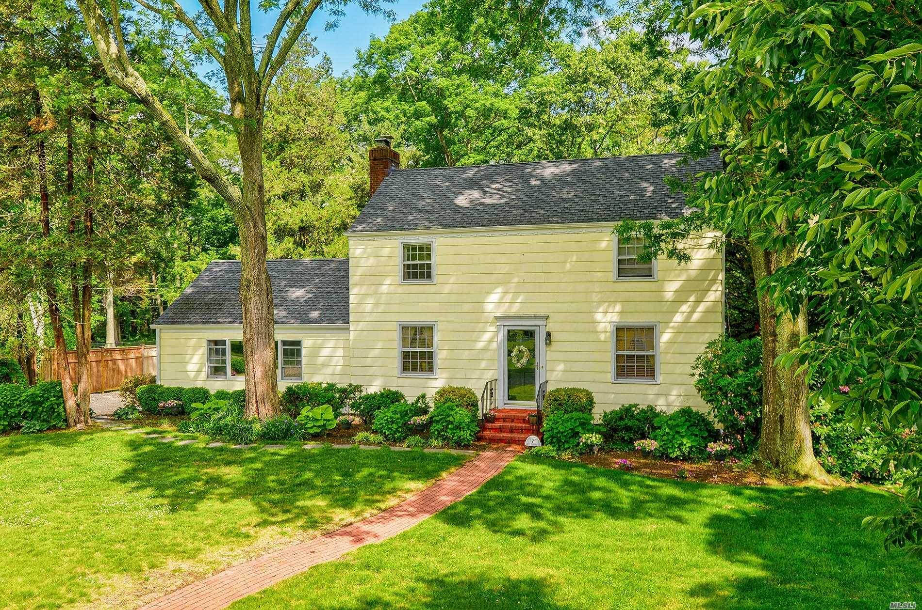 Beautiful classic center hall colonial sits on breathtaking property.