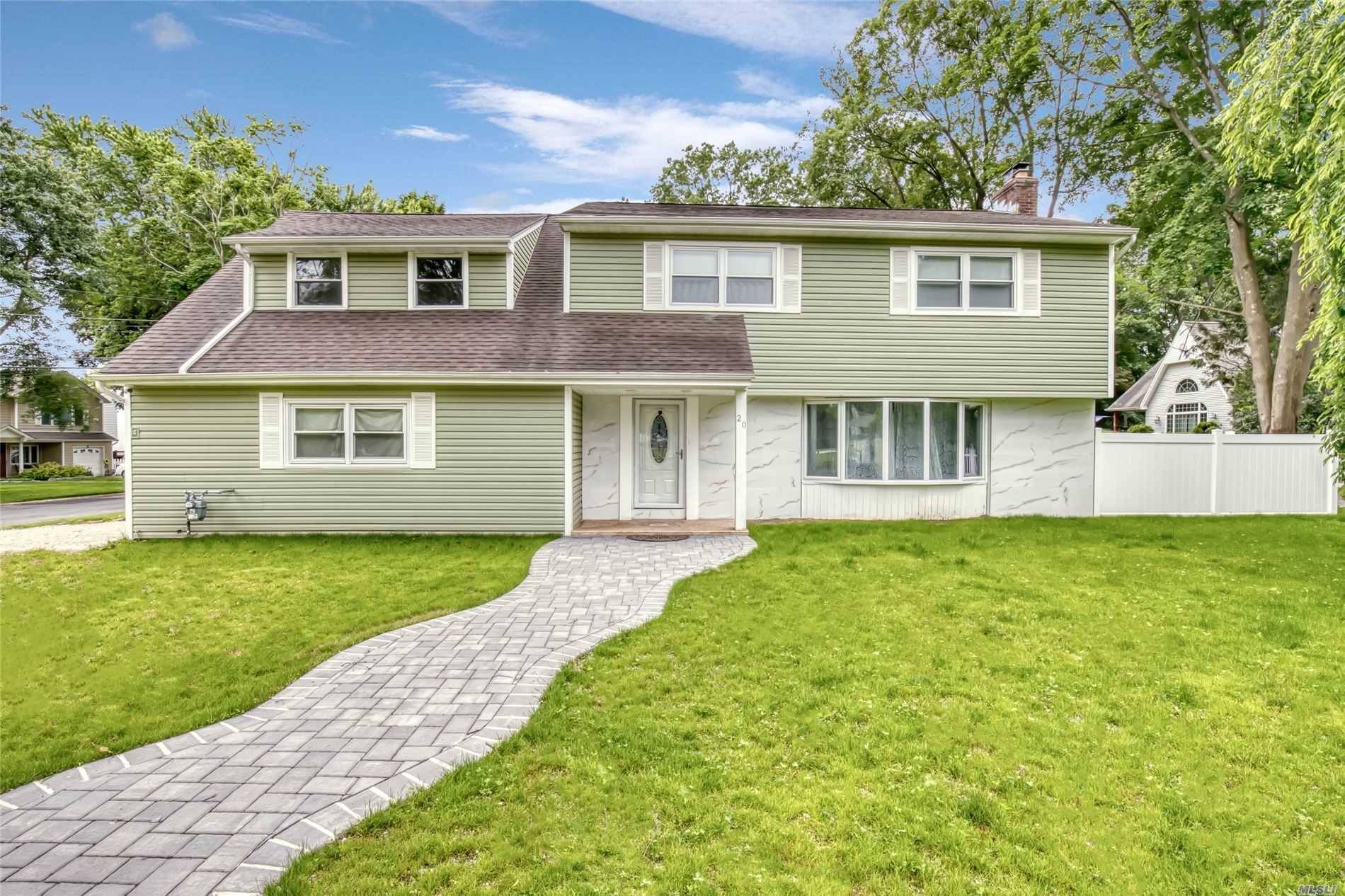 Stunningly renovated Colonial in the heart of Greenlawns award winning Harborfields School District.