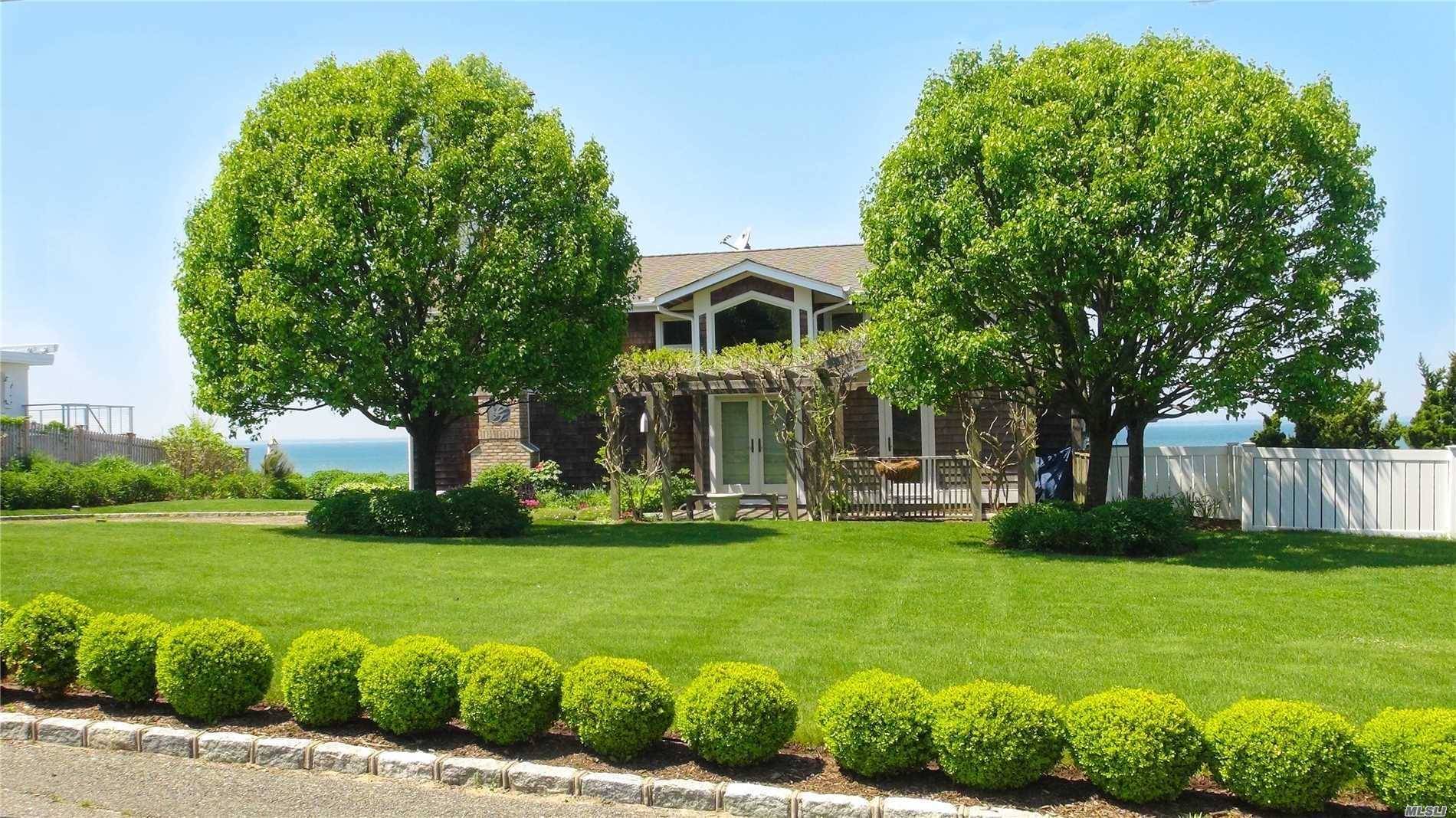 The ultimate summer getaway located beachfront on the Great Peconic Bay.