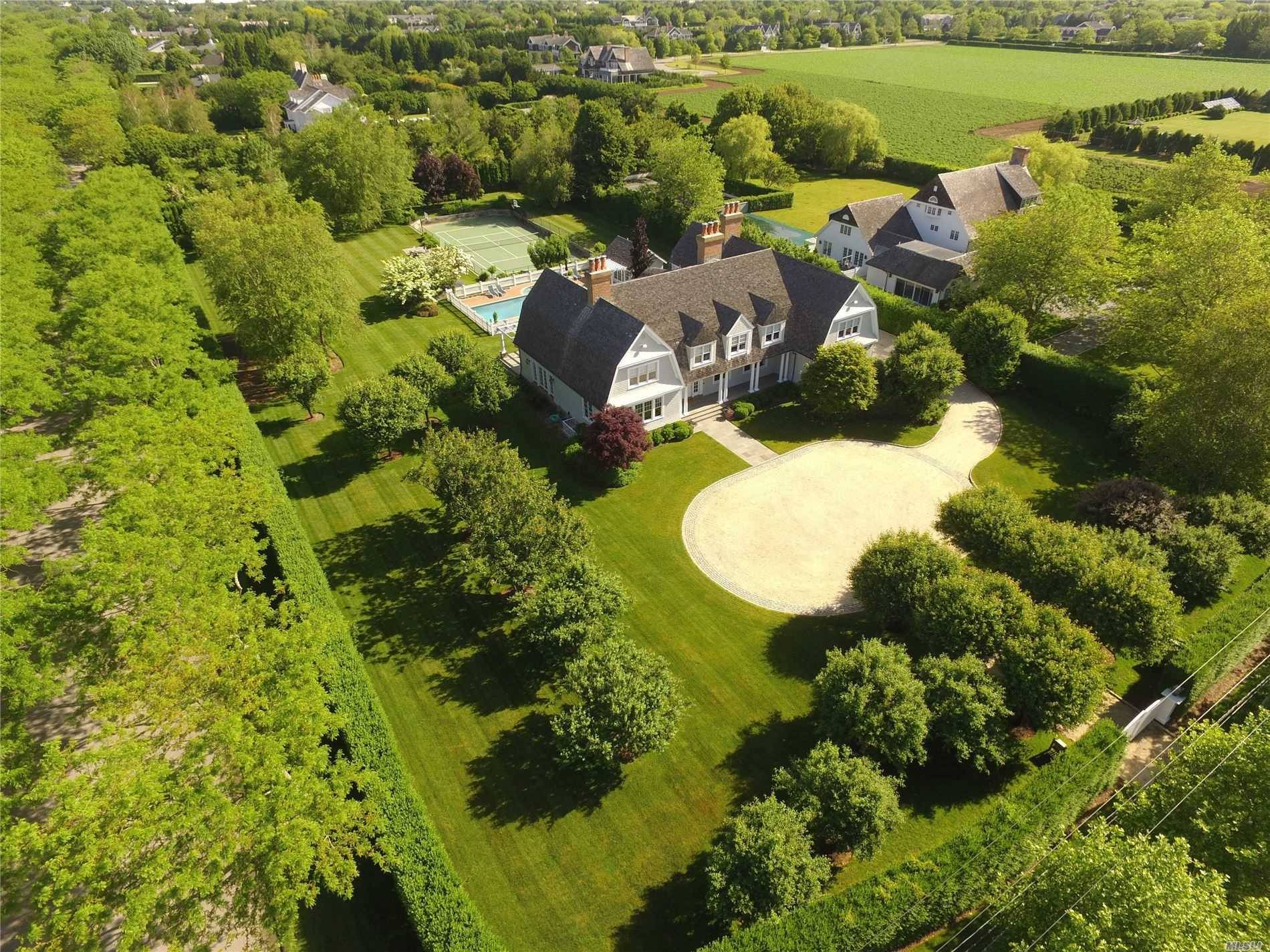 The Beachmont Impeccably maintained, this home rests on 2 acres in the Village of Southampton.