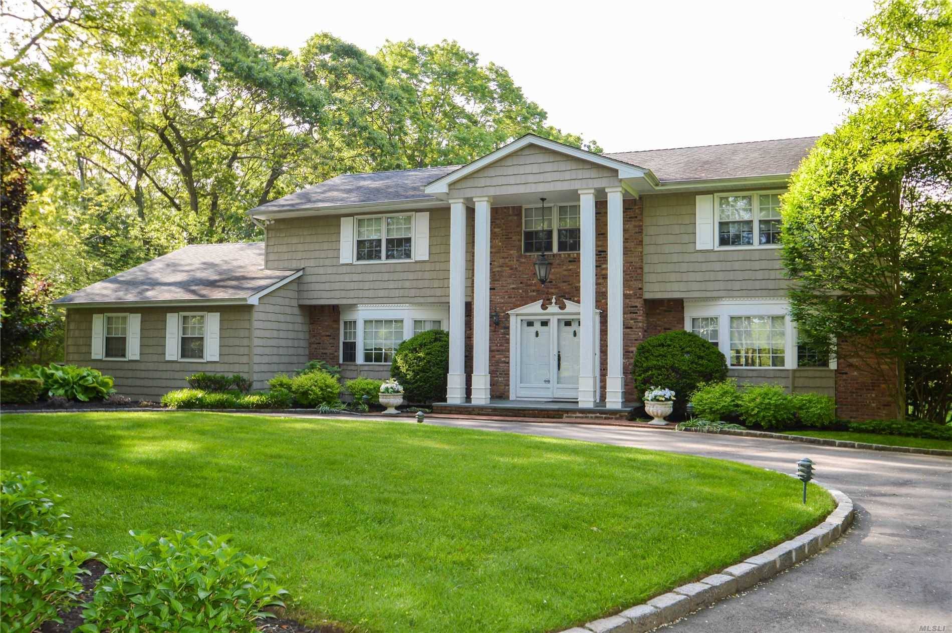 Gorgeous Center Hall Colonial w oversized rooms, large foyer custom built stairs, Huge Liv rm, Banquet dining Rm, Lg den w o sized stone fplc, 1st fl bedroom full bath ...